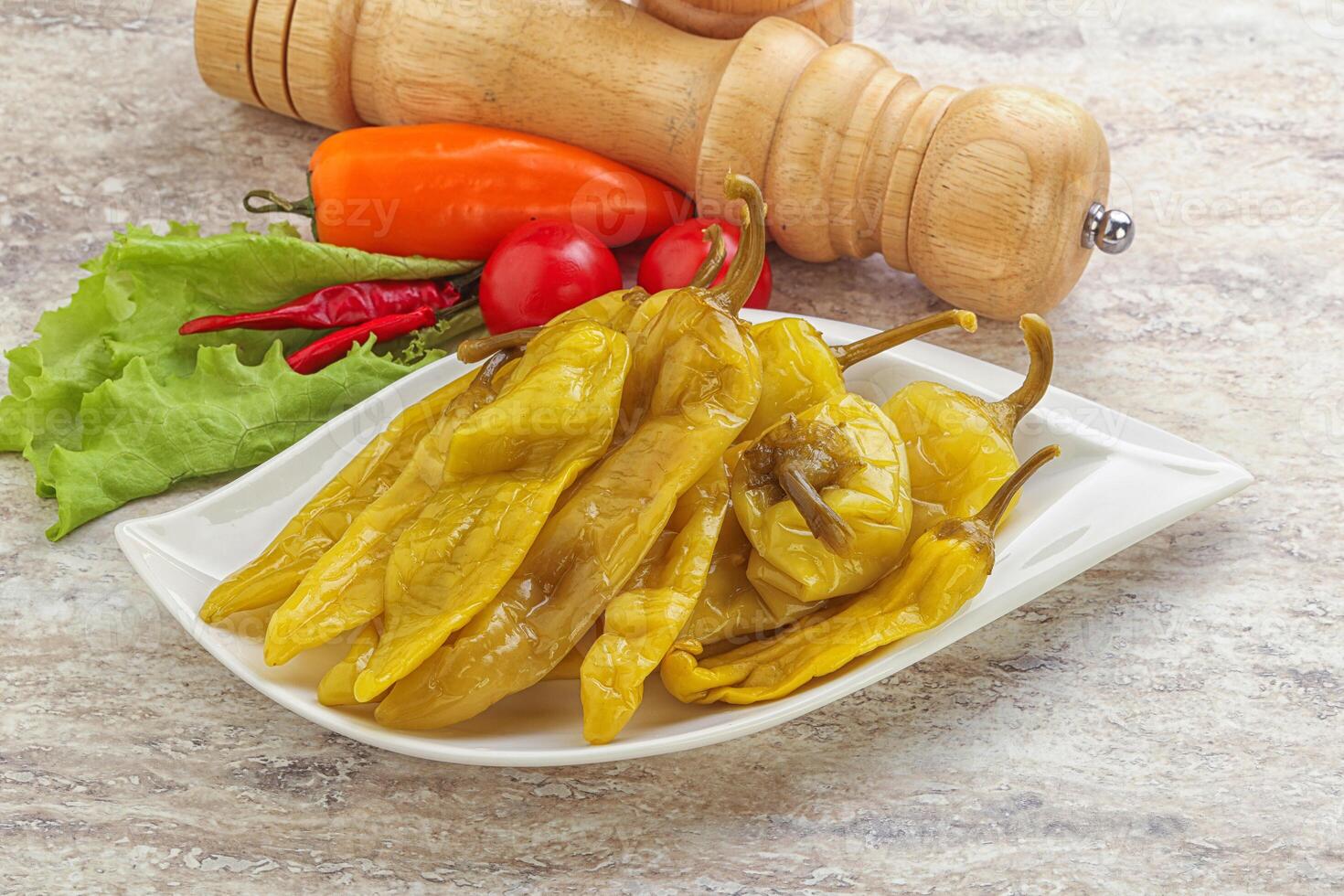 Pickled marinated spicy green pepper photo