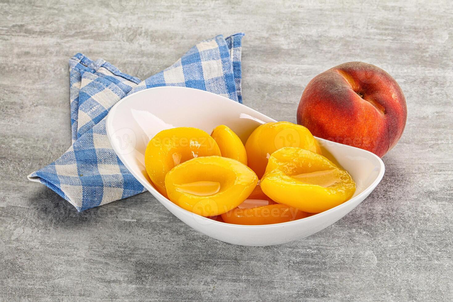 Ripe sweet and juicy canned peach photo