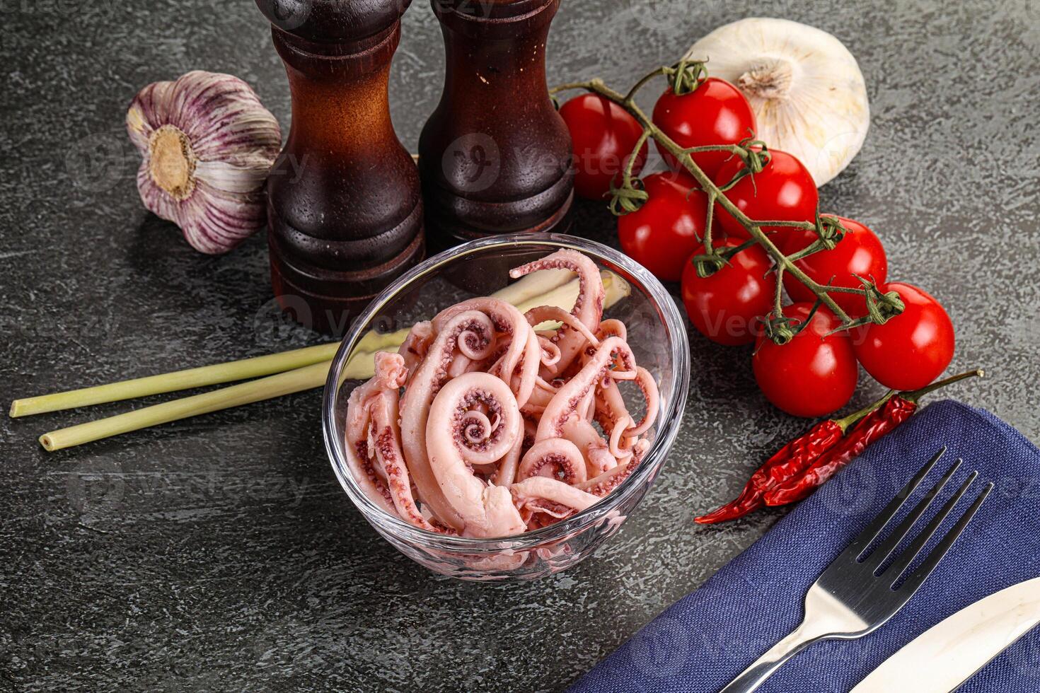 Delicous marinated squid tentacles in the bowl photo