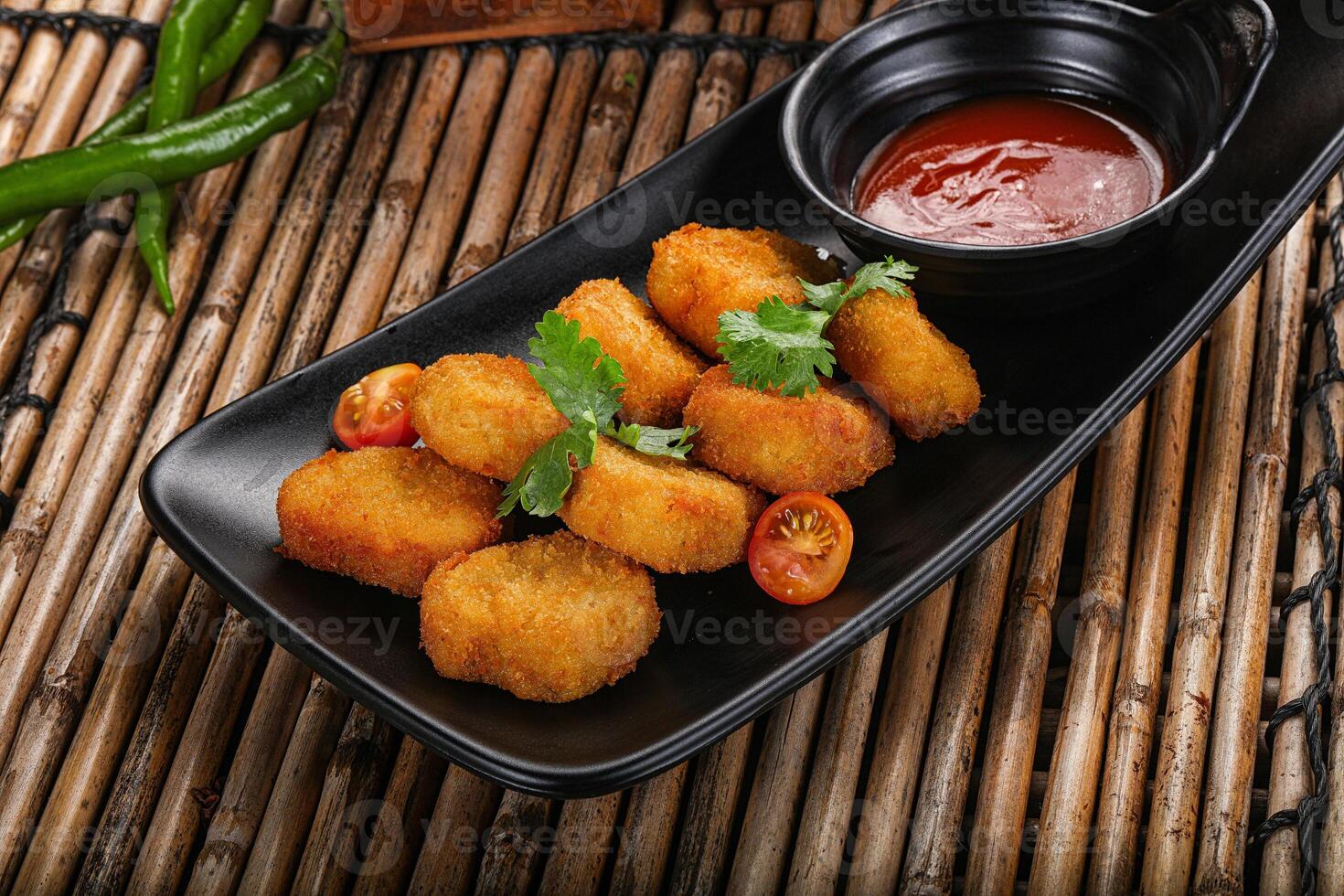 Crispy golden choclen nuggets with sauce photo