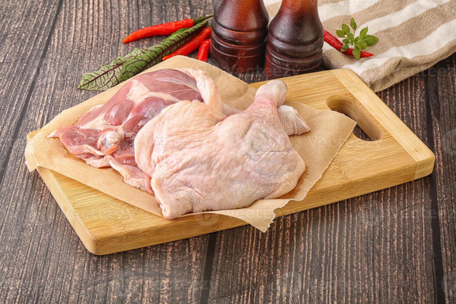 Raw duck leg ready for cooking photo