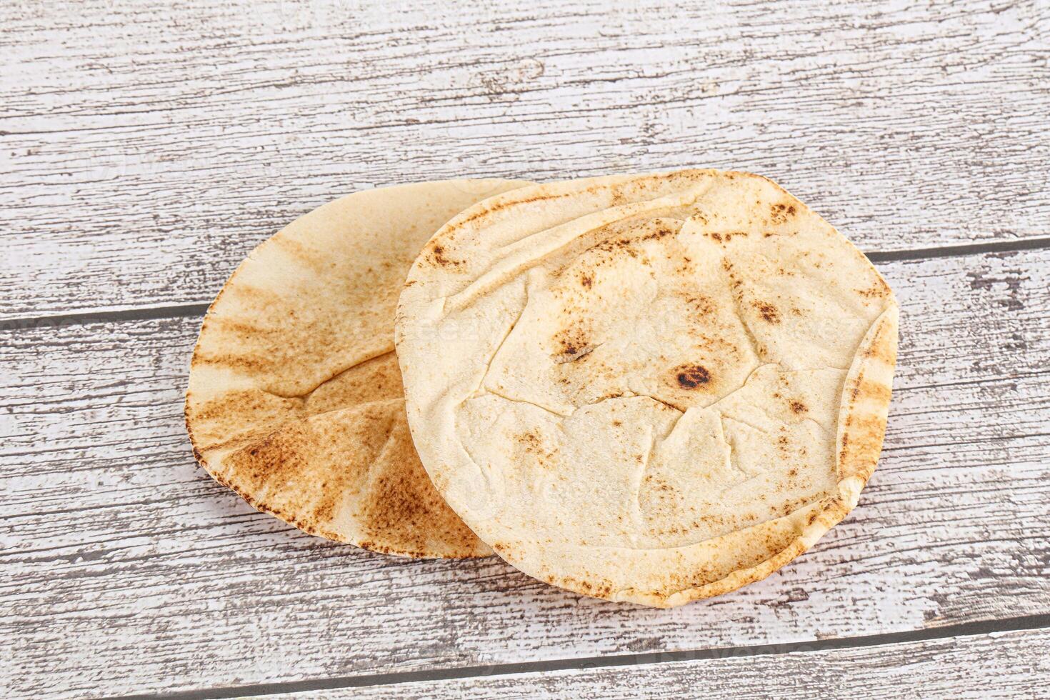 Traditional eastern round pita bread photo