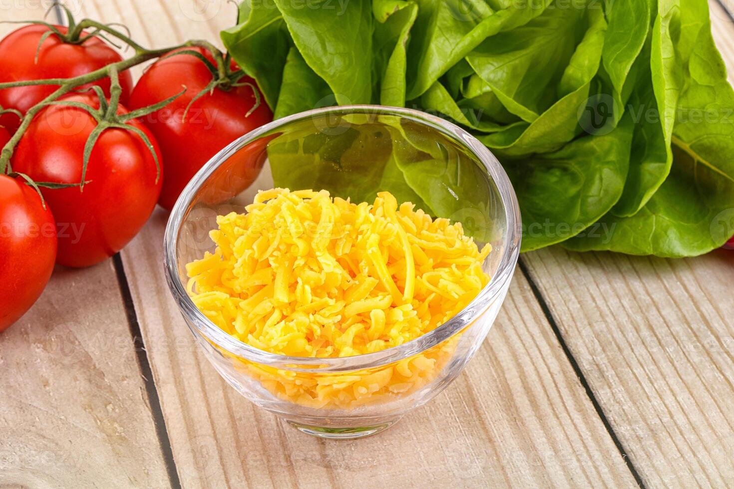 Shredded cheese in the bowl photo