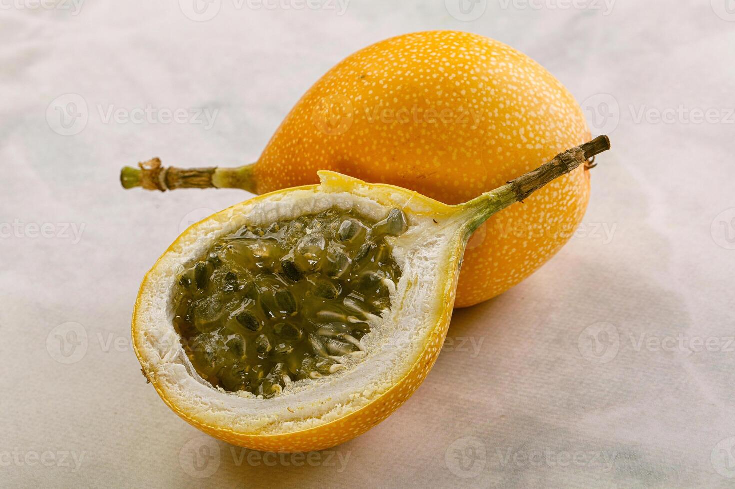 Yellow granadilla with cut half photo