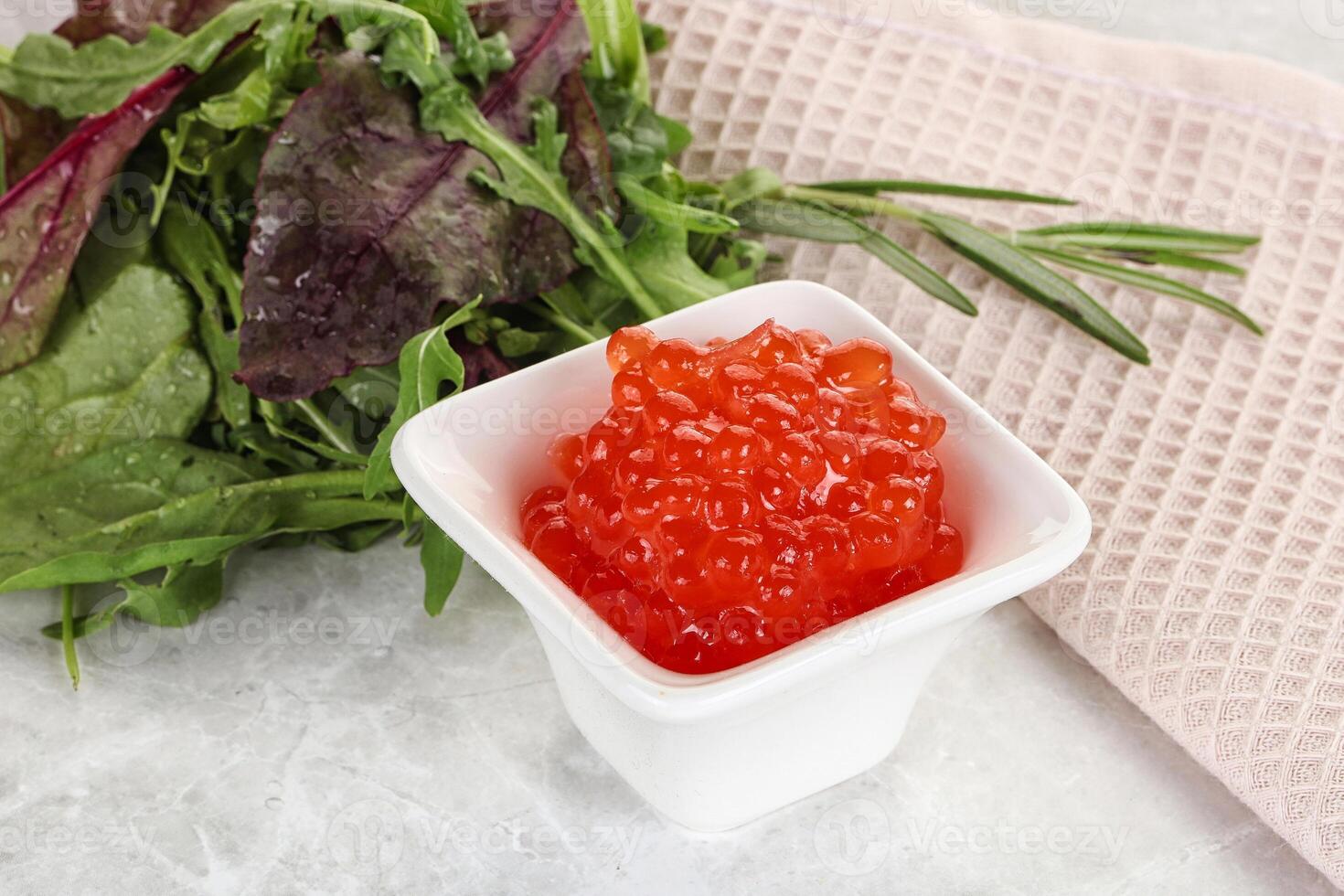 Red caviar in the bowl photo