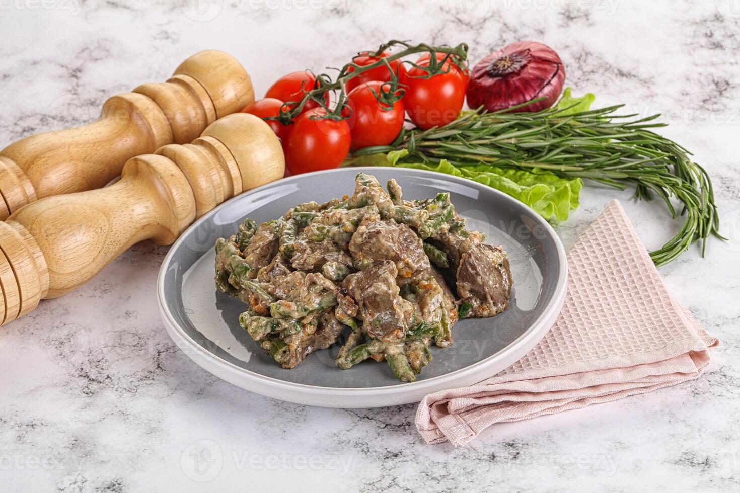 Fried turkey liver with herbs in cream sauce photo