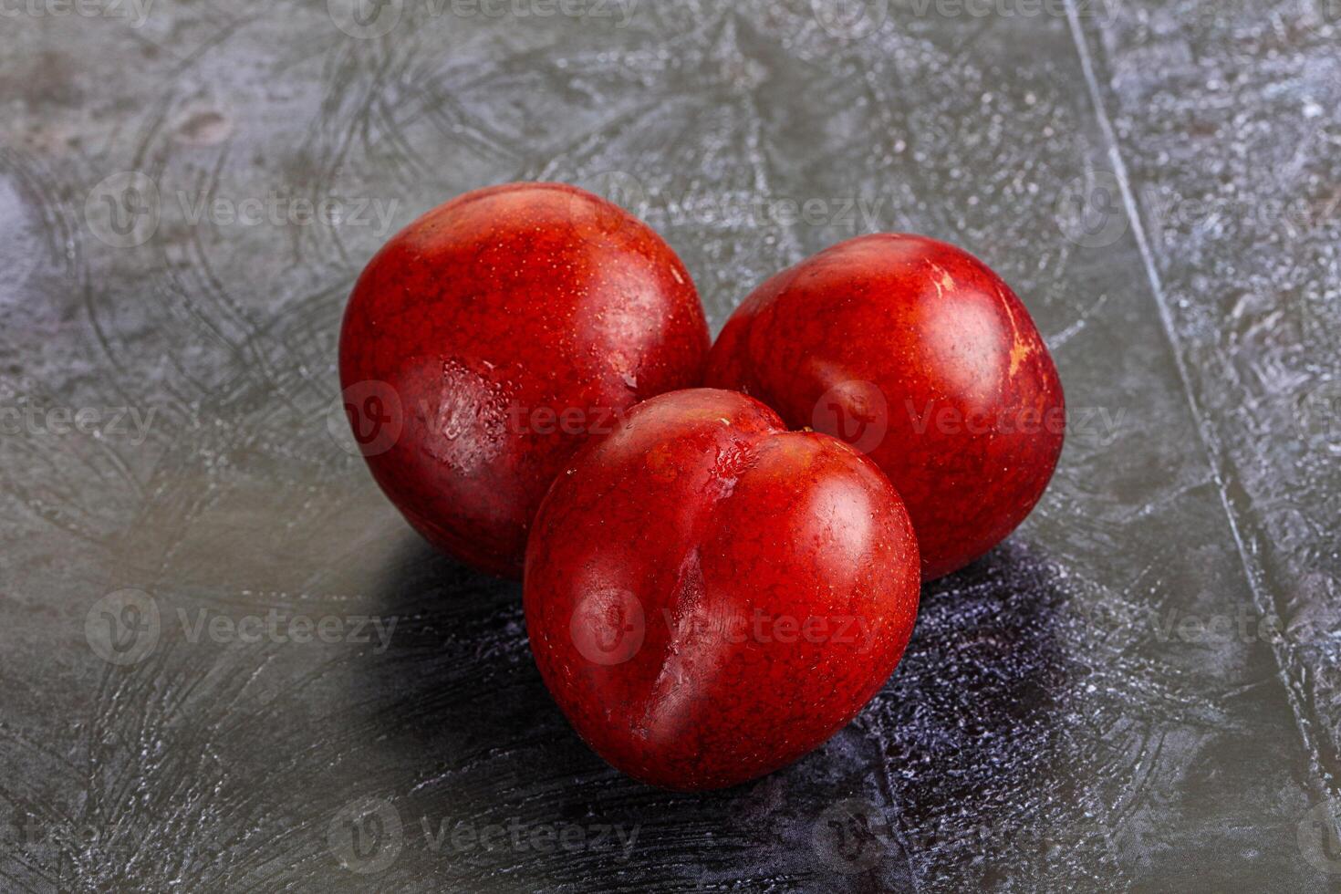 Ripe sweet juicy red plum photo