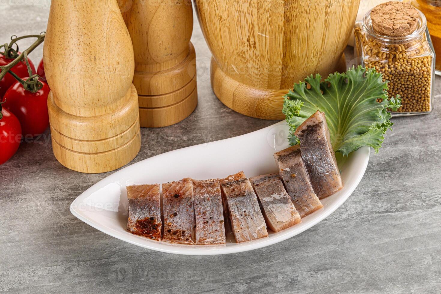 Sliced salted herring fillet snack photo