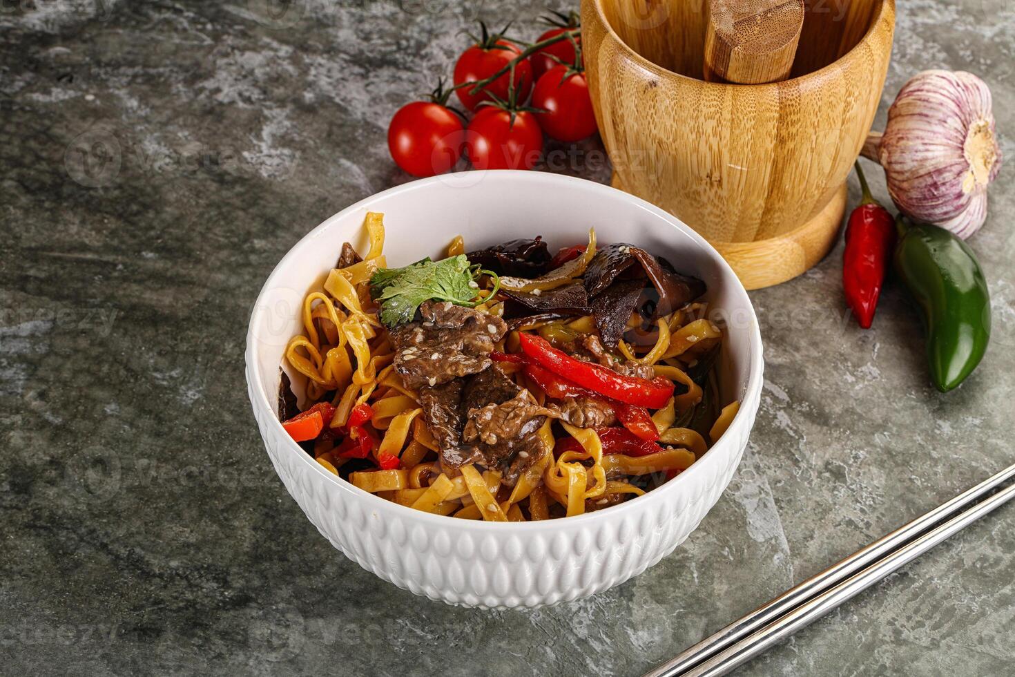 Asian wok with noodle, vegetables and beef photo