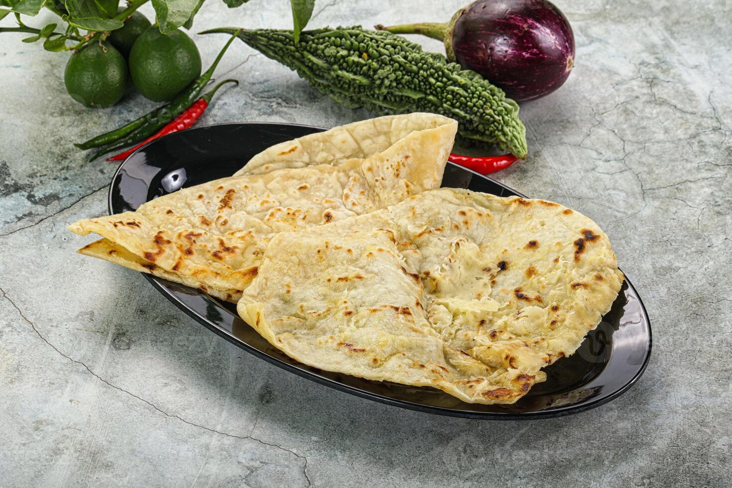 Indian tandori bread - naan with cheese photo