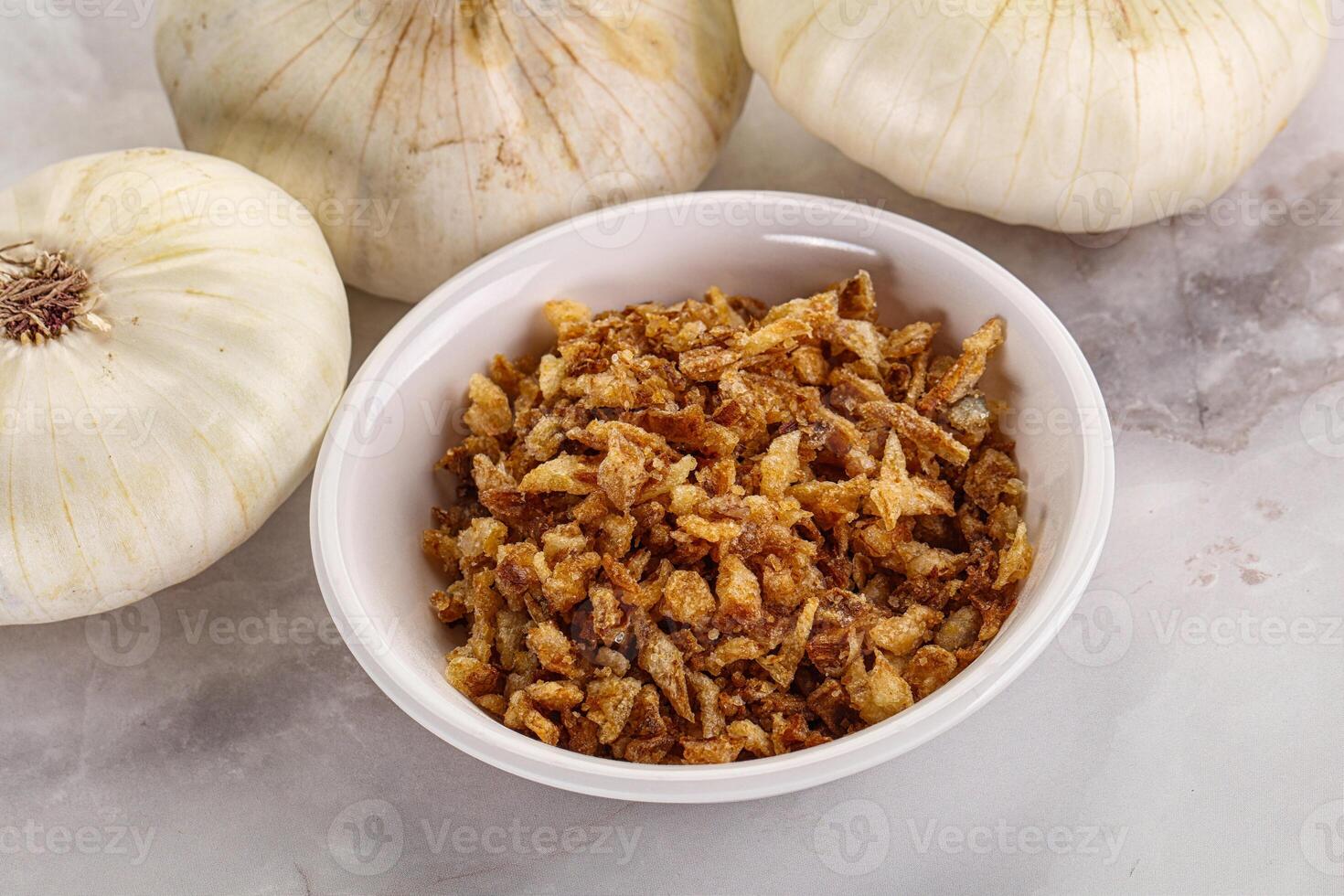 Dried roasted onion flakes for culinary photo