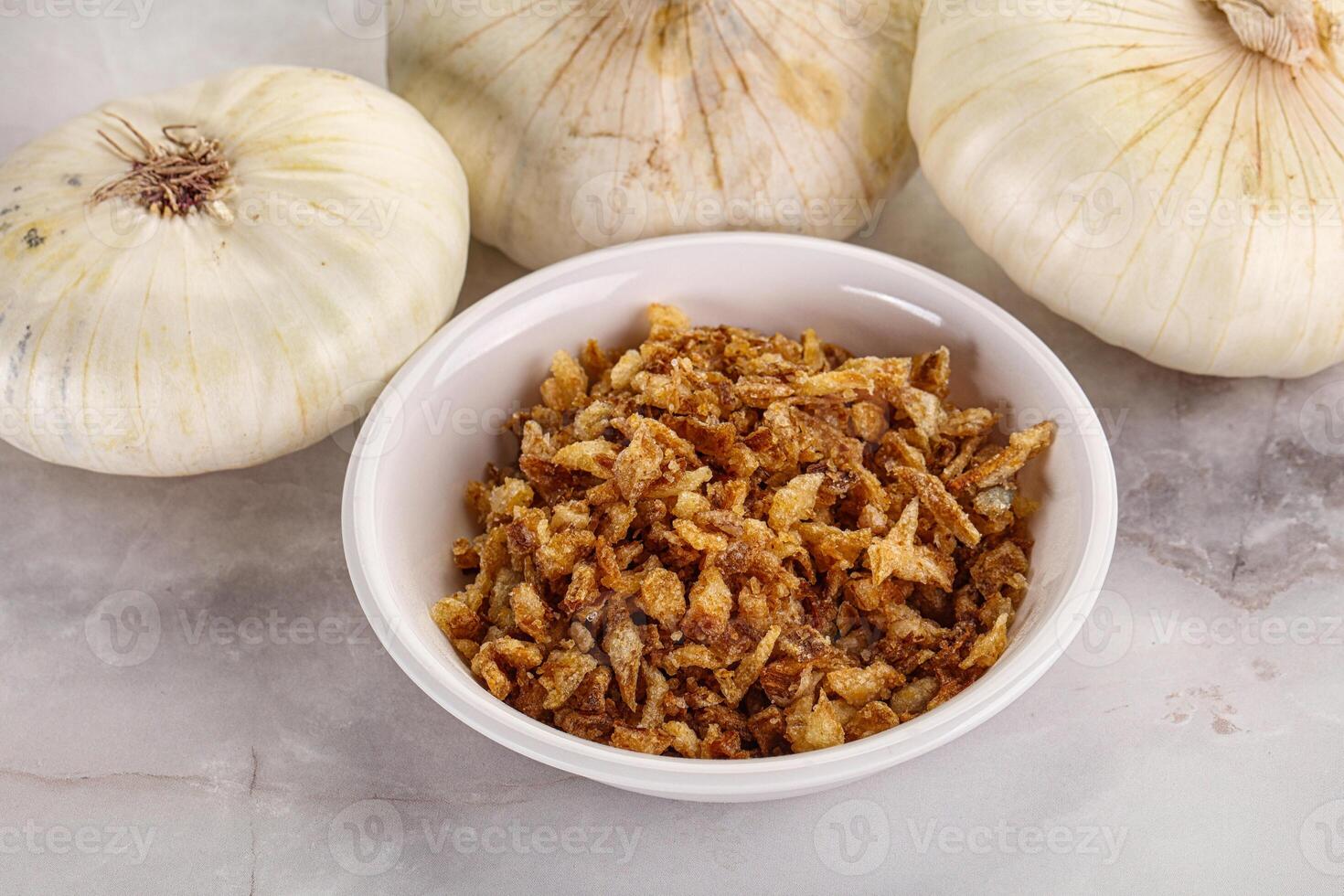 Dried roasted onion flakes for culinary photo