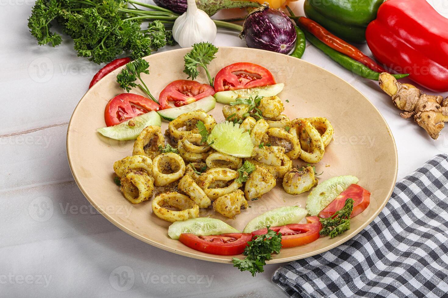 Grilled squid with lime and vegetables photo