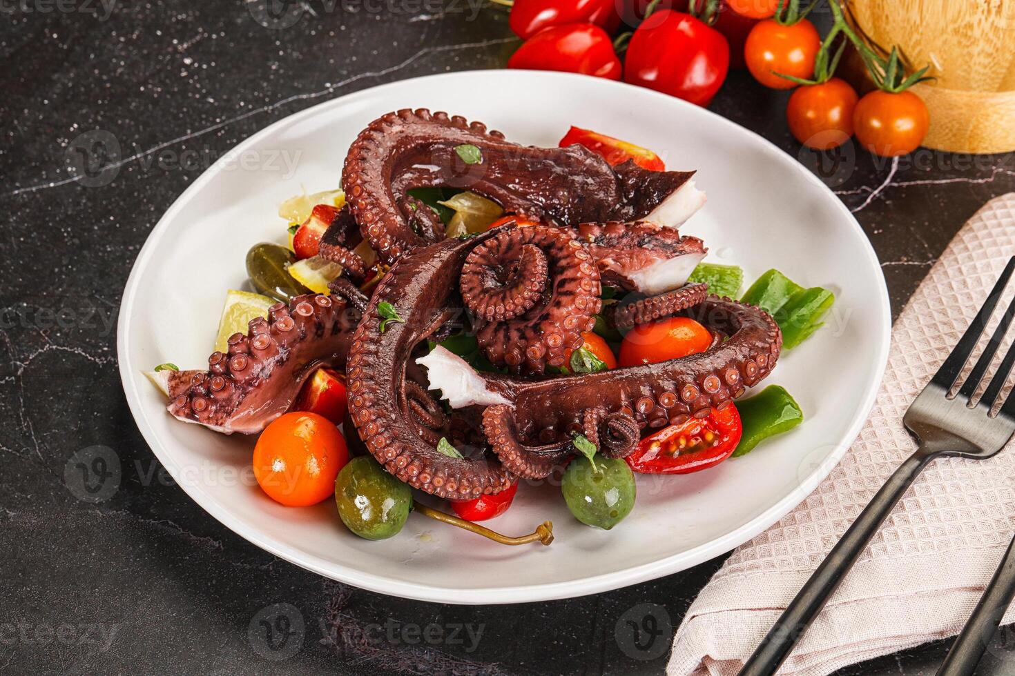 Salad with octopus tentacle and vegetables photo