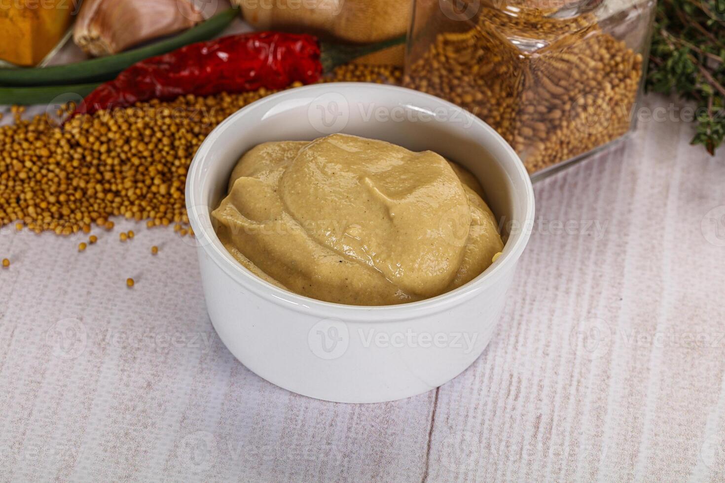 Dijon mustard sauce in the bowl photo