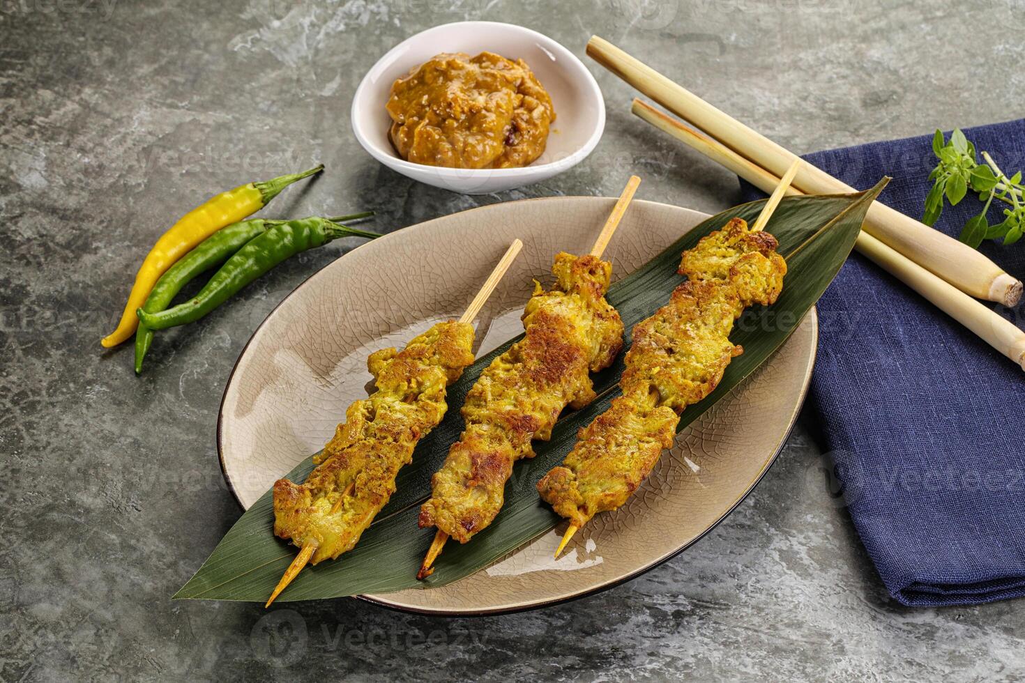 Thai meat skewer Satay with sauce photo