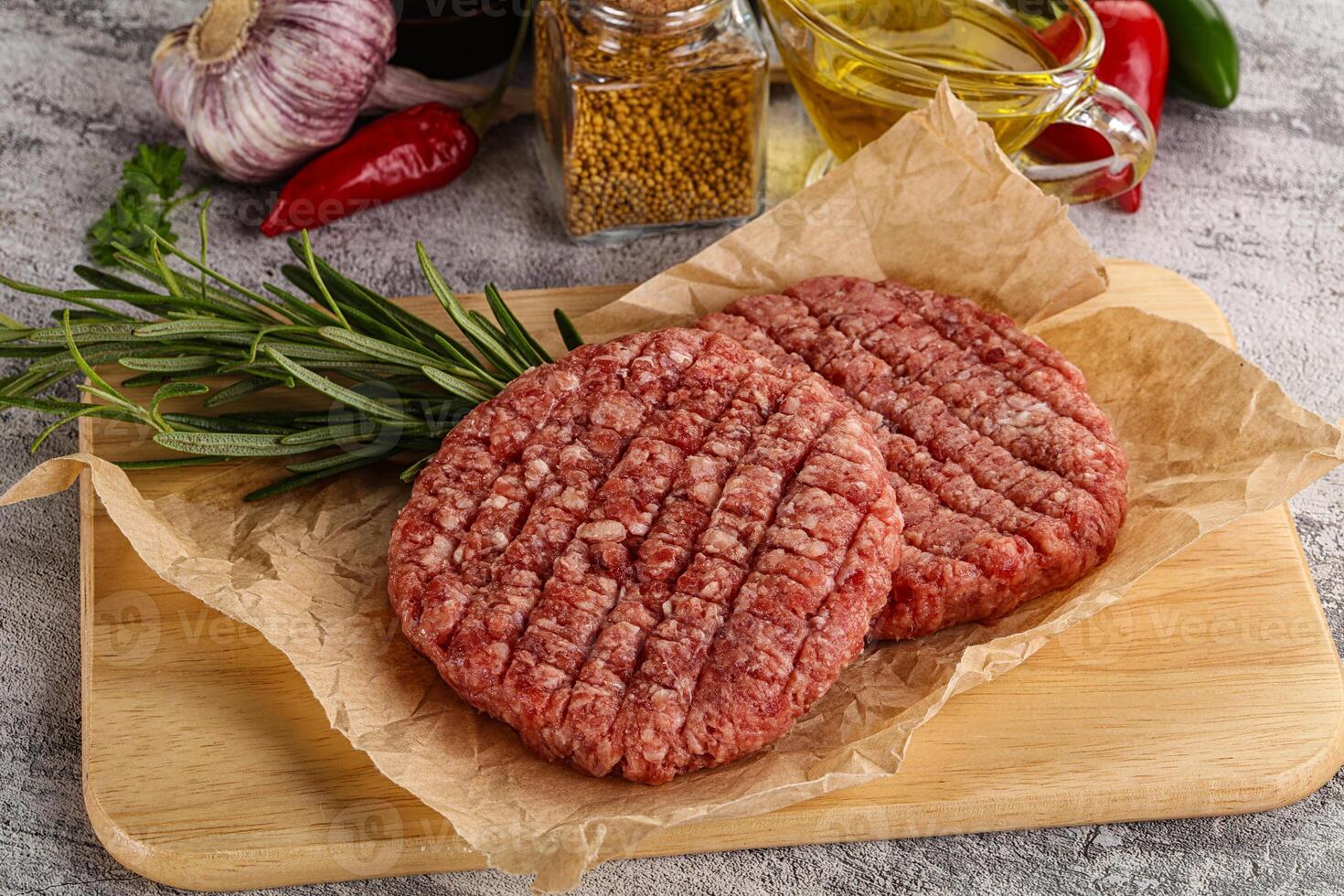 Raw burger cutlet for grill photo