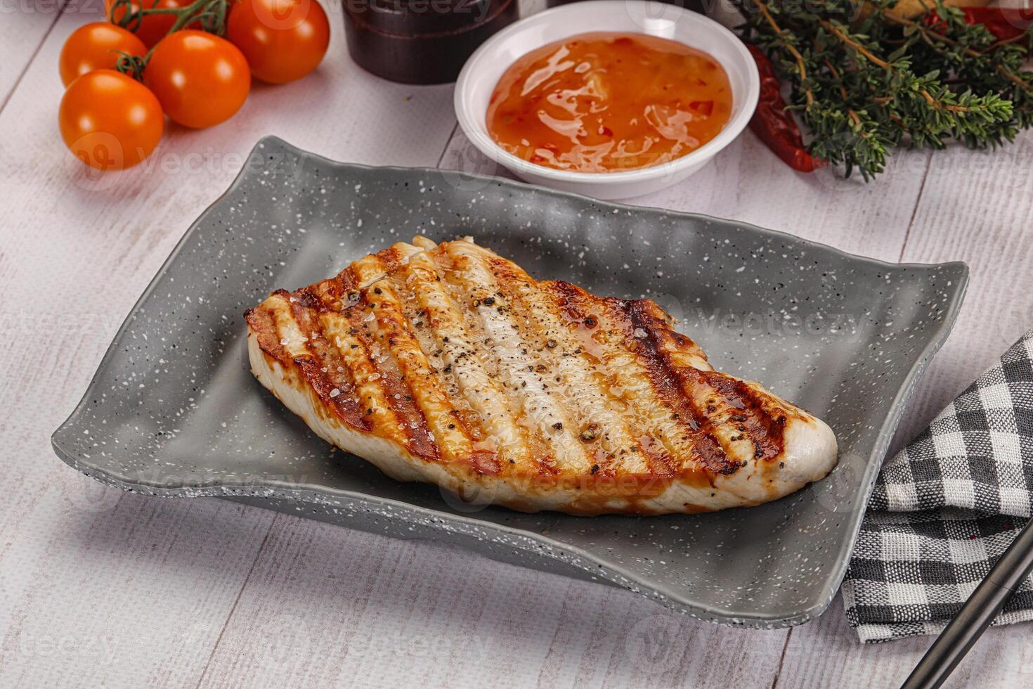 Grilled turkey fillet steak with sauce photo