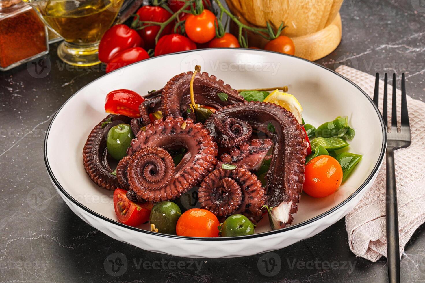 Salad with octopus tentacle and vegetables photo