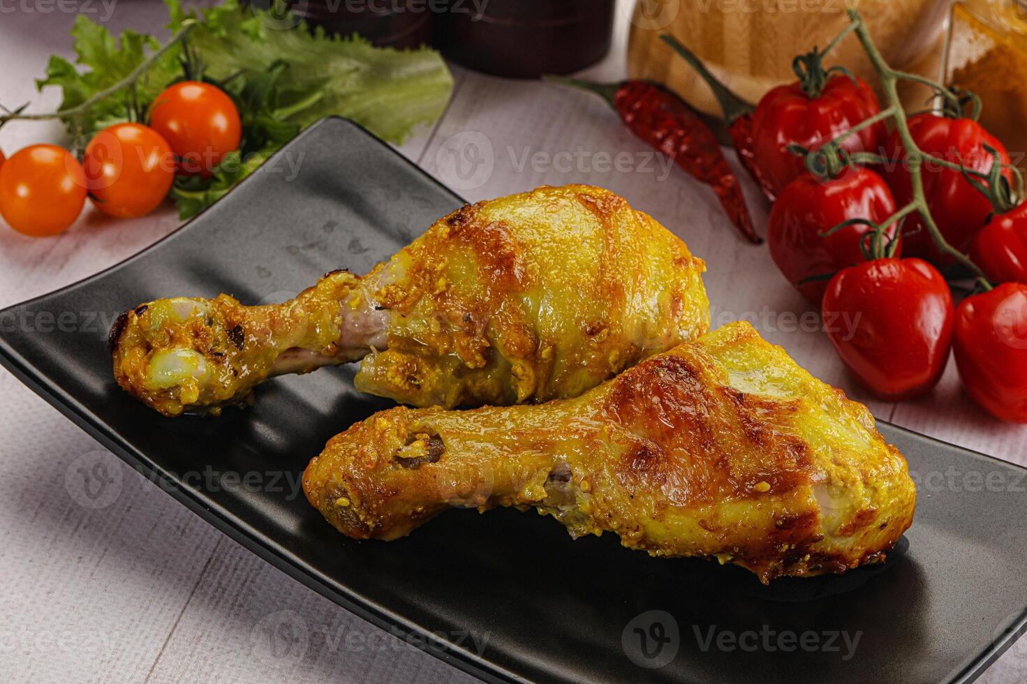 Roasted Chicken leg drumsticks with curry sauce photo