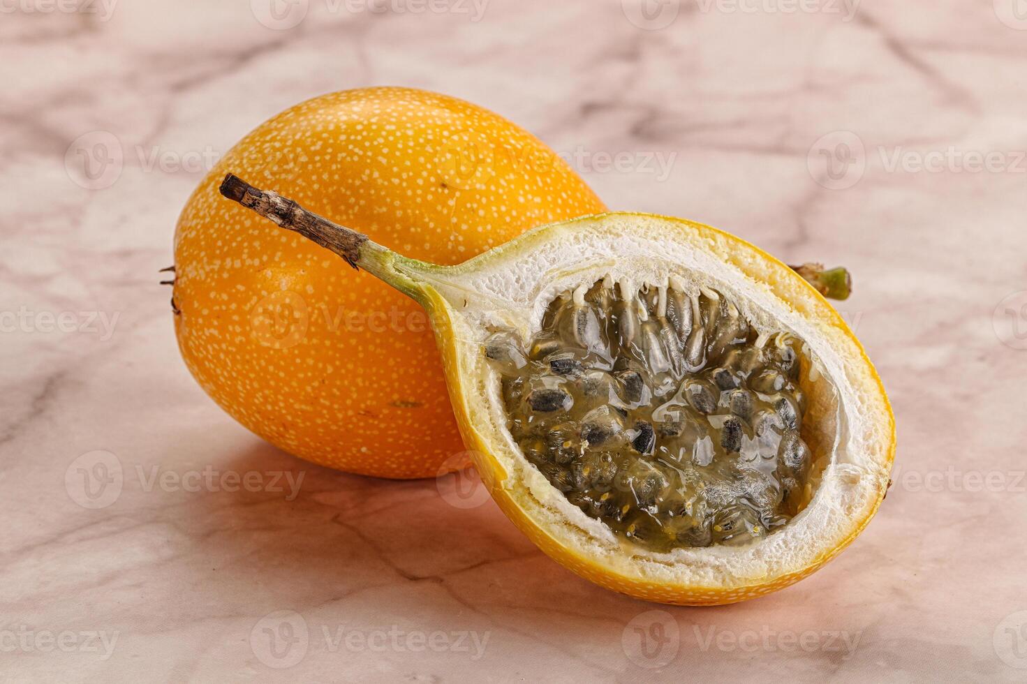 Yellow granadilla with cut half photo