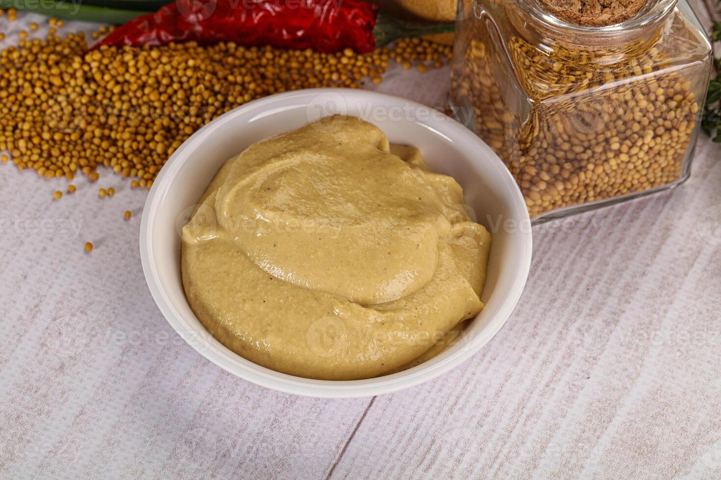 Dijon mustard sauce in the bowl photo