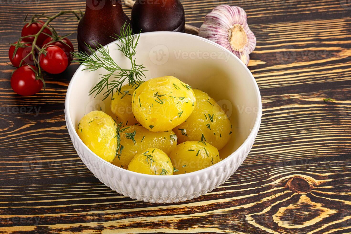 Boiled potato with oil and dill photo