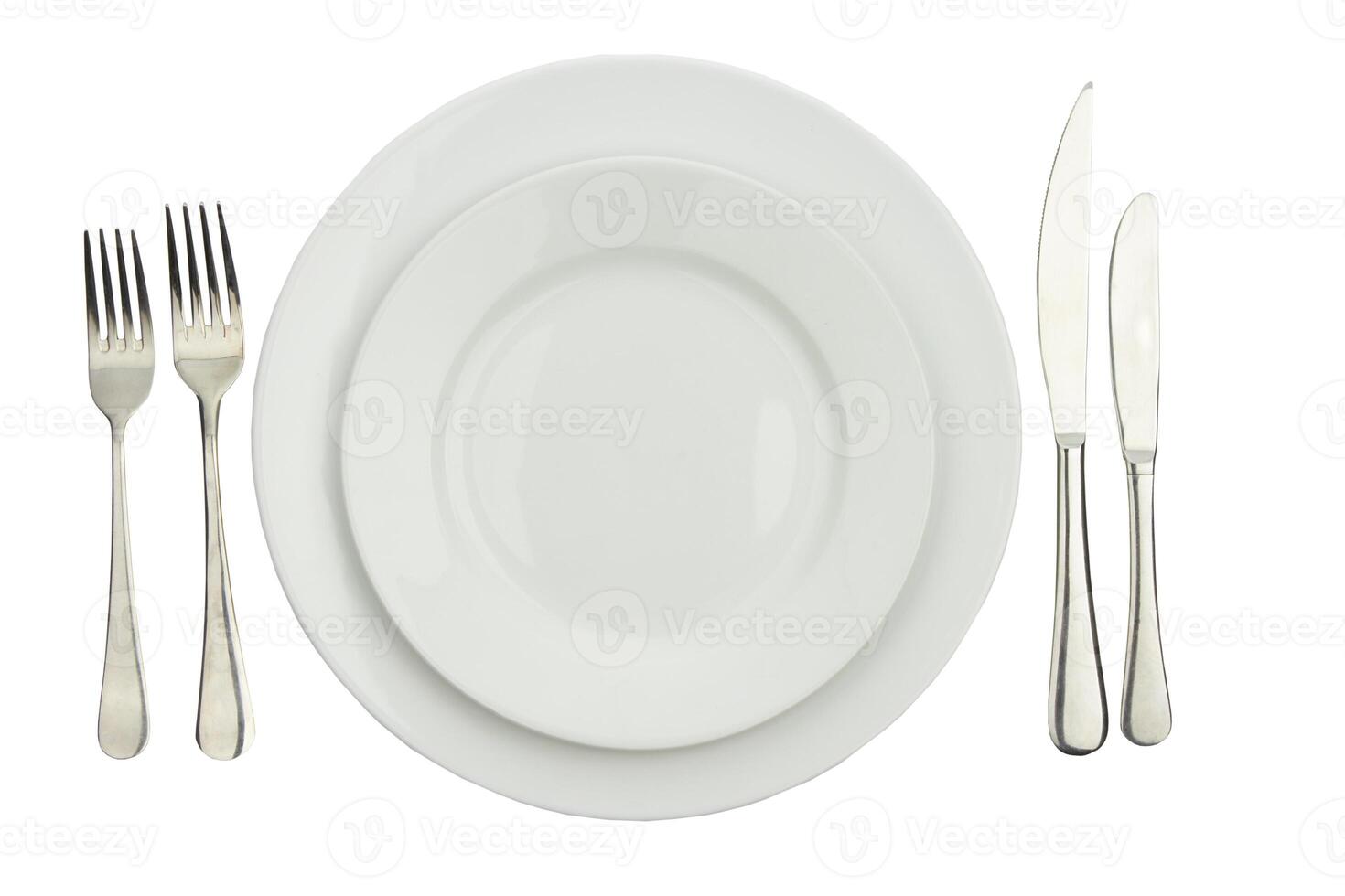 Place setting with high-gloss plate, knife fork. photo