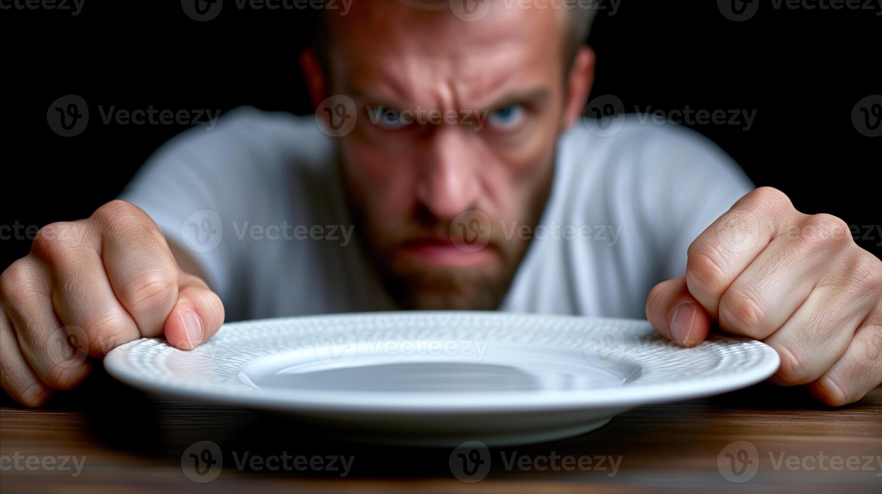 AI generated Frustrated man with empty plate expressing hunger or diet concept photo