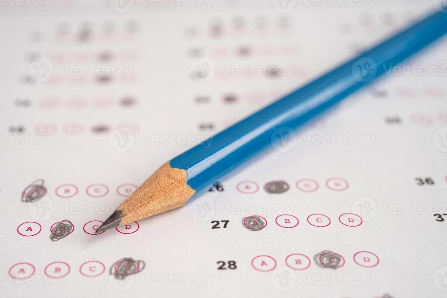 Answer sheets with pencil drawing fill to select choice, education concept. photo