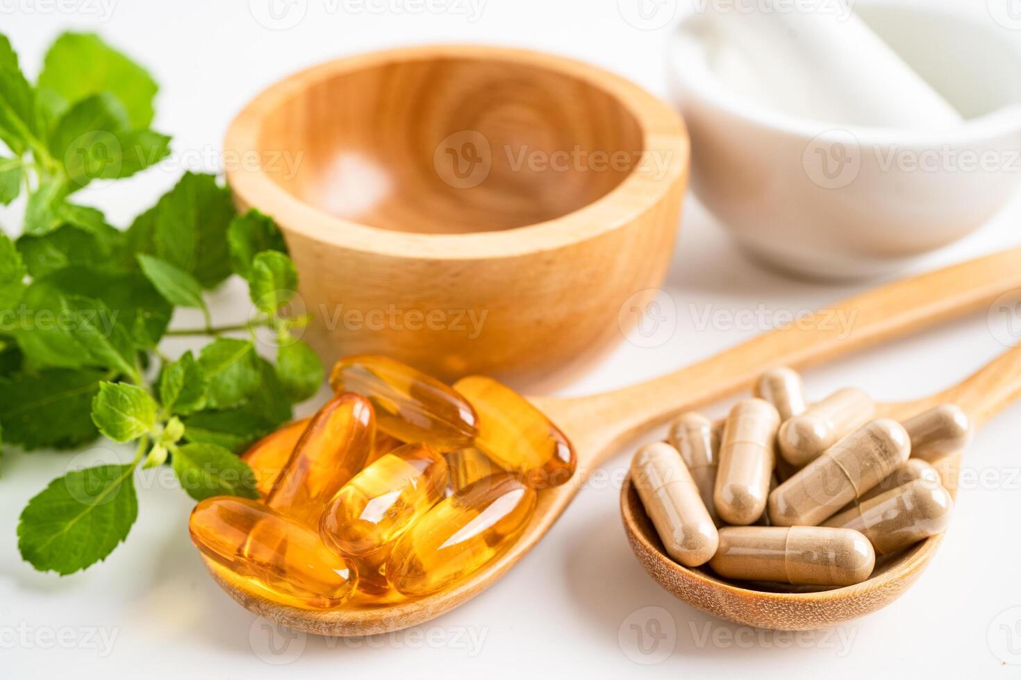 Alternative medicine herbal organic capsule with vitamin E omega 3 fish oil, mineral, drug with herbs leaf natural supplements for healthy good life. photo