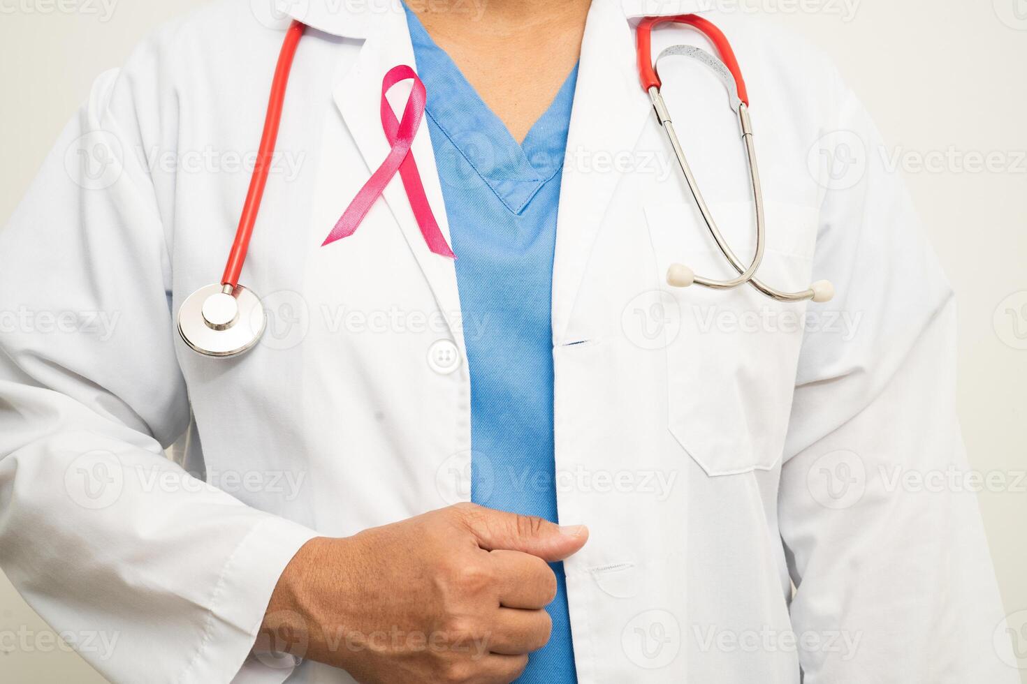 Breast cancer, Asian doctor woman with pink ribbon, symbol of World Breast Cancer Day. photo