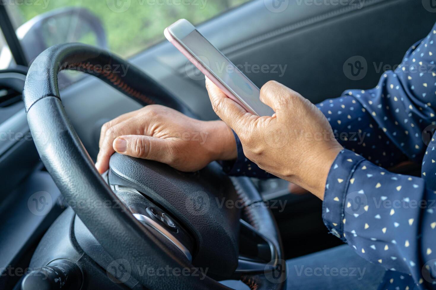 Holding iPhone in toyota sienta car to communication with family and friends. photo