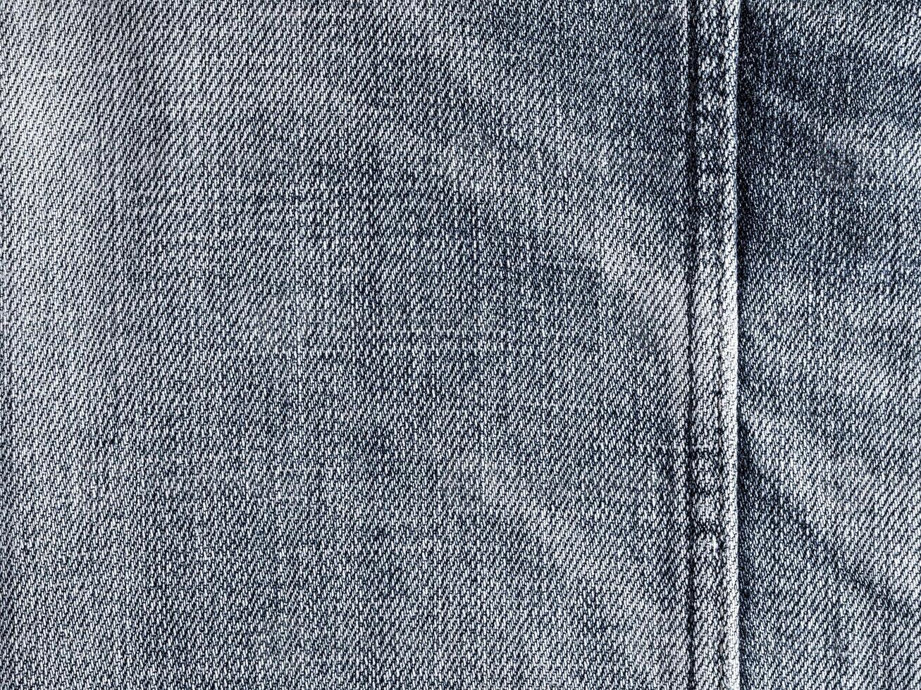 Texture and seam of denim fabric photo