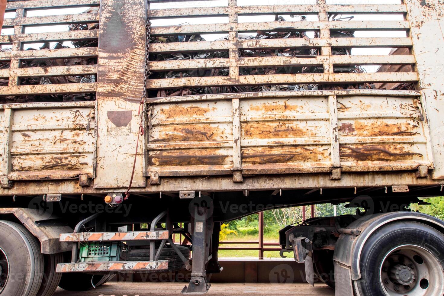 Scrap steel in the old steel crate in the truck photo