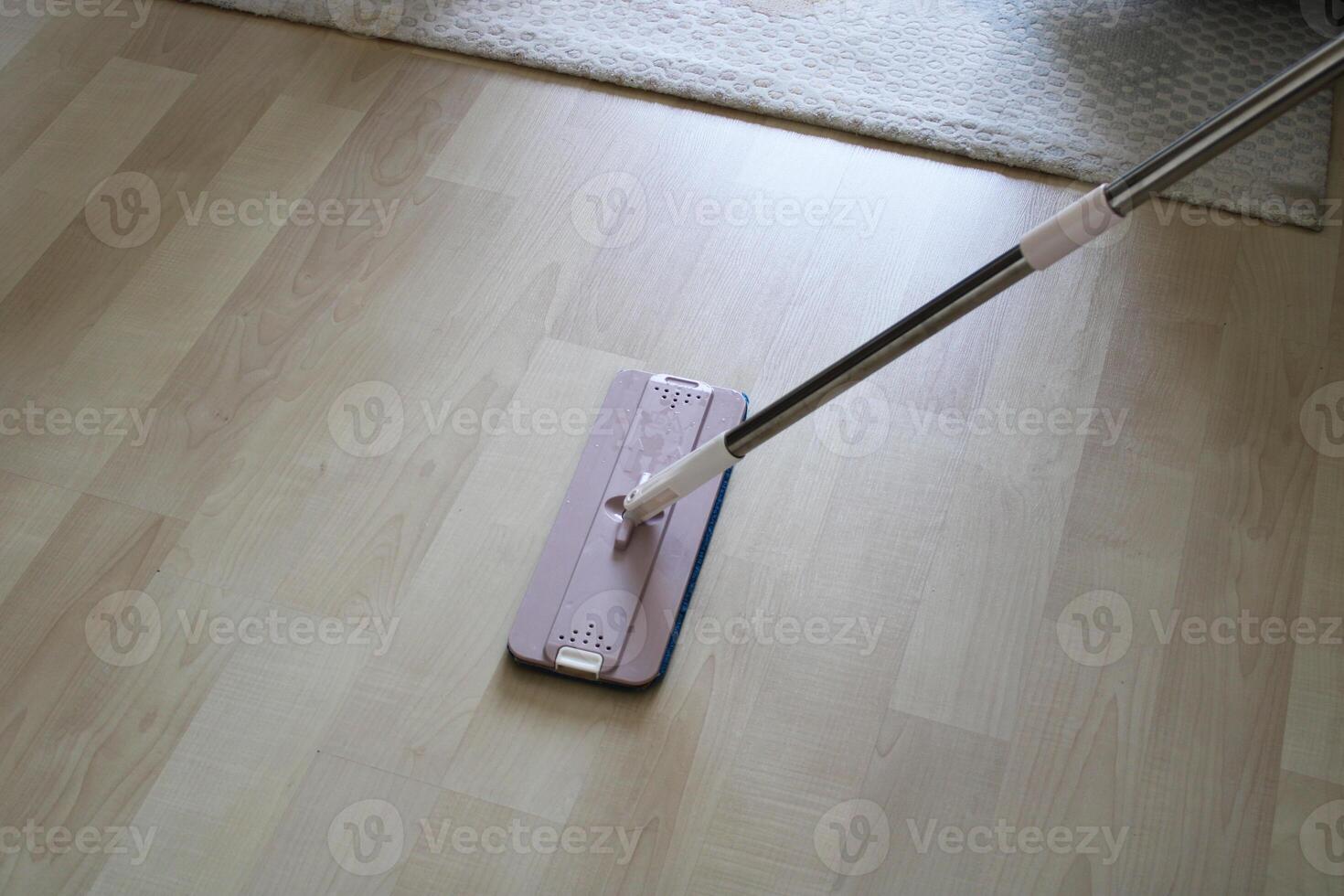 mop cleaning on floor at home photo