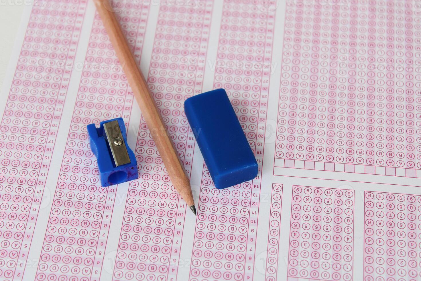 Pencil and eraser on the optical form. photo