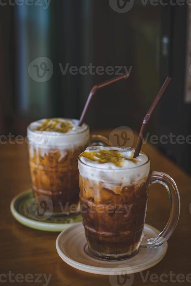 Iced coffee with whipped cream in a glass cup, stock photo