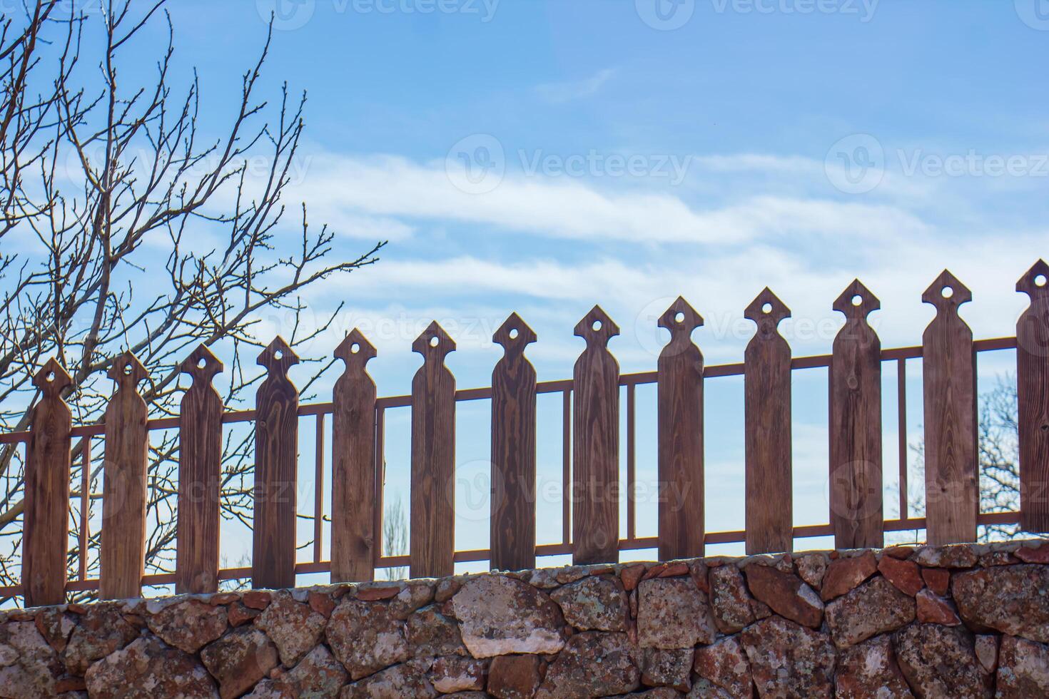 wooden fence on blue sky background, wooden fence and blue sky photo