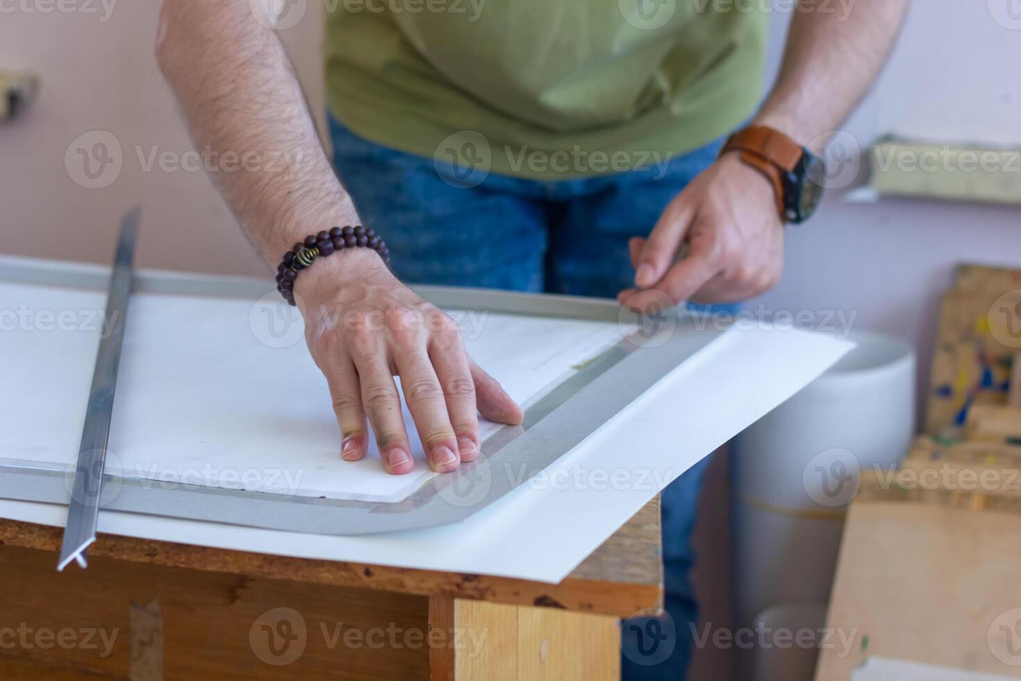 artist at work in a studio, artist painting picture photo