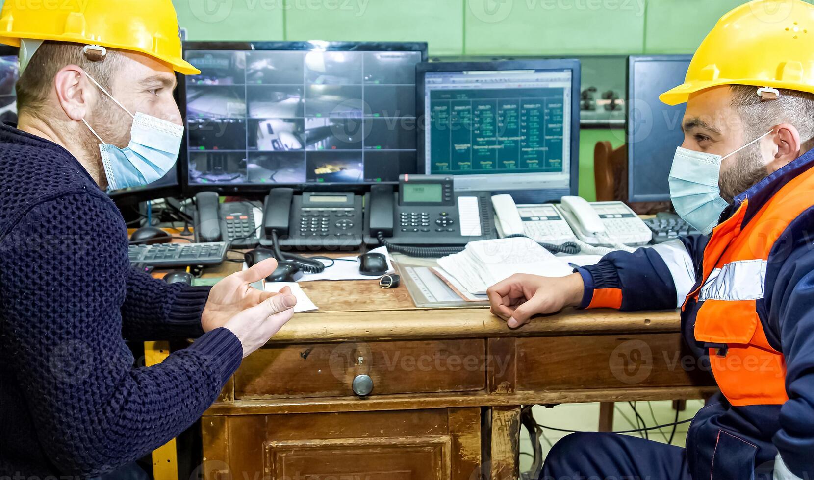 industrial workers at the work in factory photo