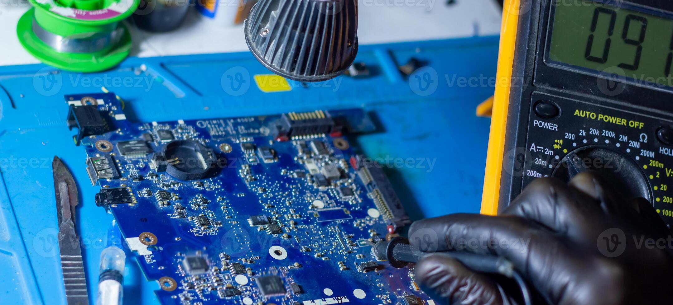 service worker repairing personal computer board photo