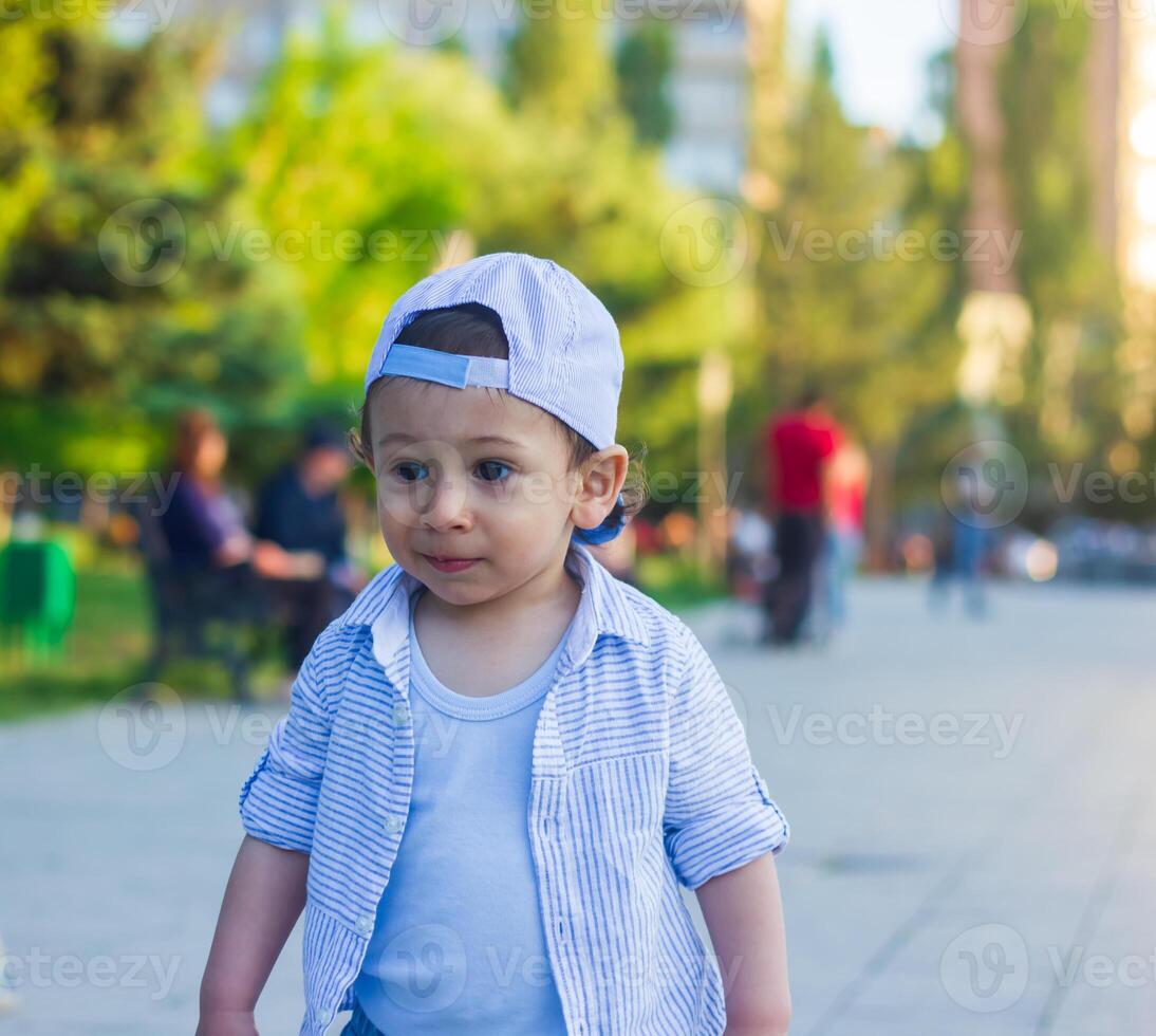 small boy playing in the park photo