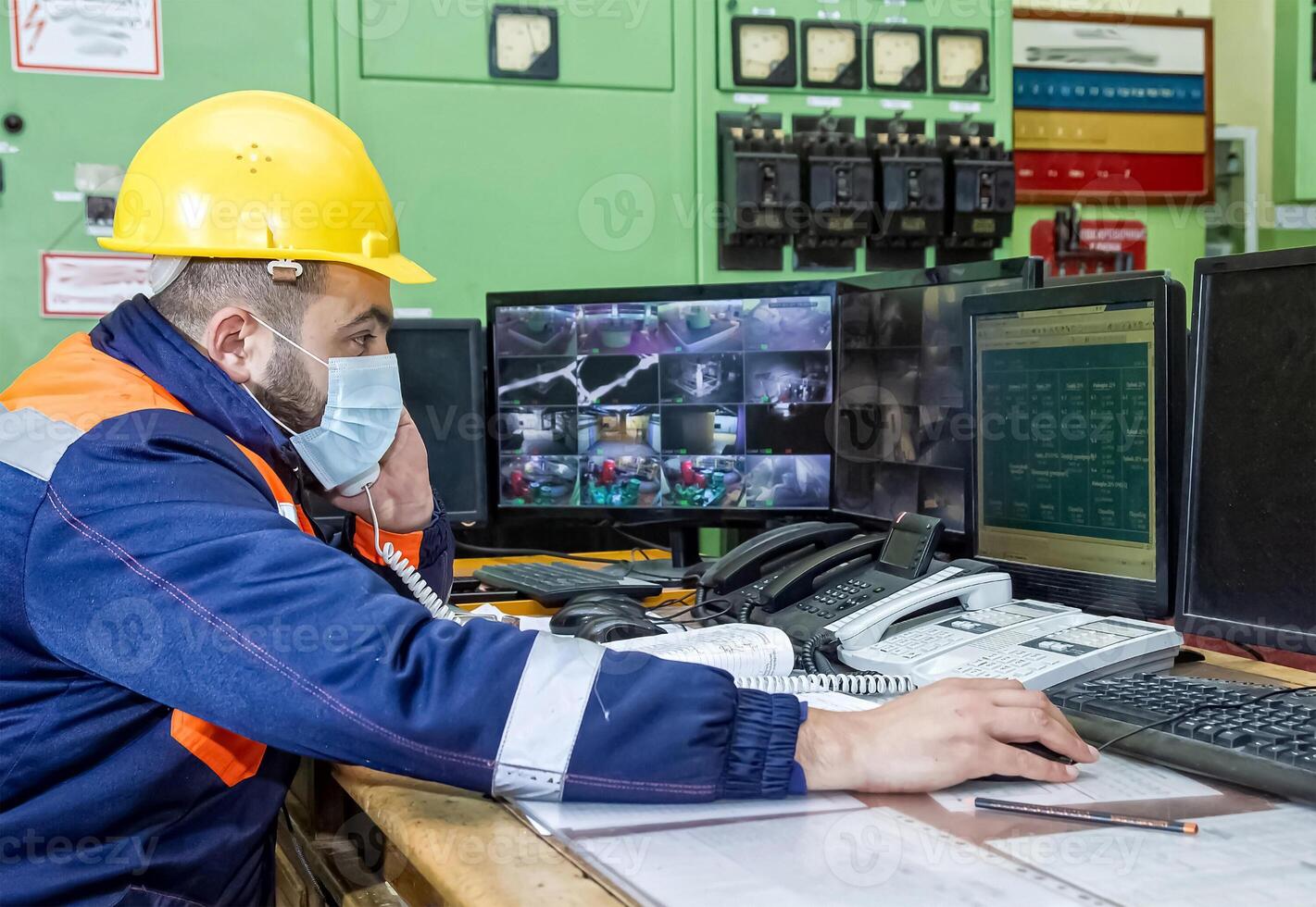 industrial workers at the work in factory photo