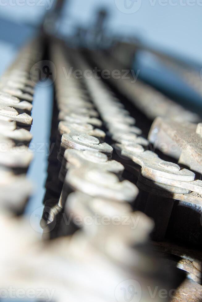 close up detail of a crane, close up of a rusty steel chain photo