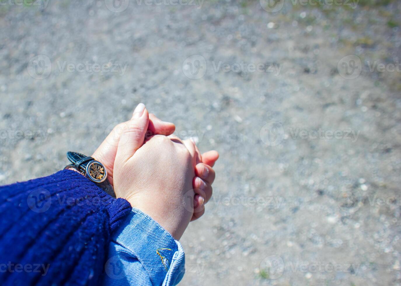 woman holding his husband hand photo