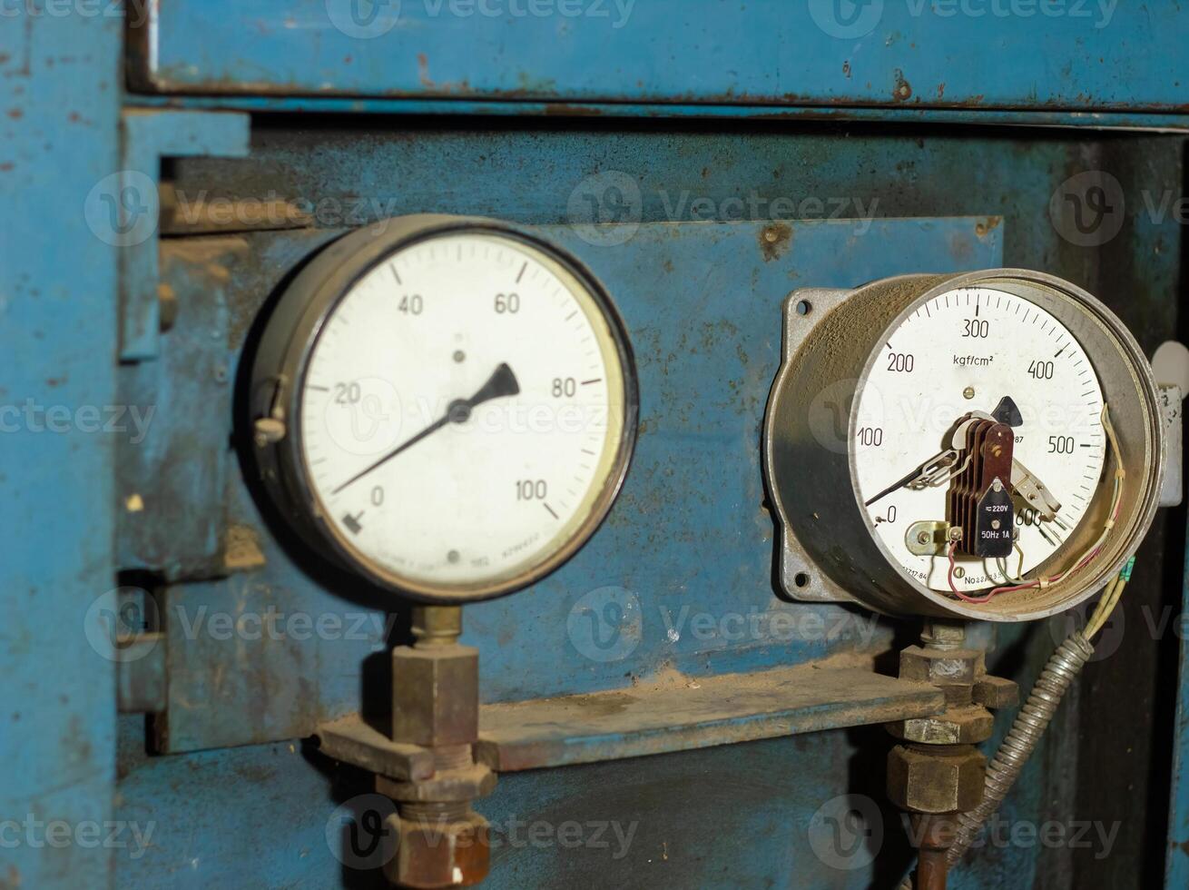 old rusty industrial machine in a factory, close up of an industrial machine photo