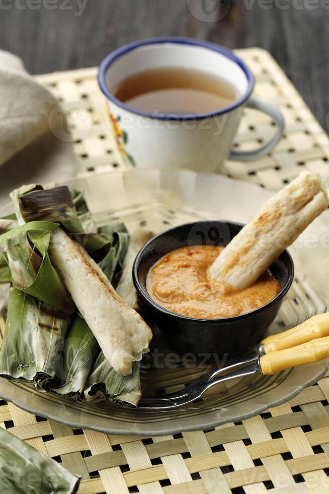 Otak-Otak is a Traditional Indonesian Fish Cake Made From Minced Fish Wrapped in Banana Leaf photo