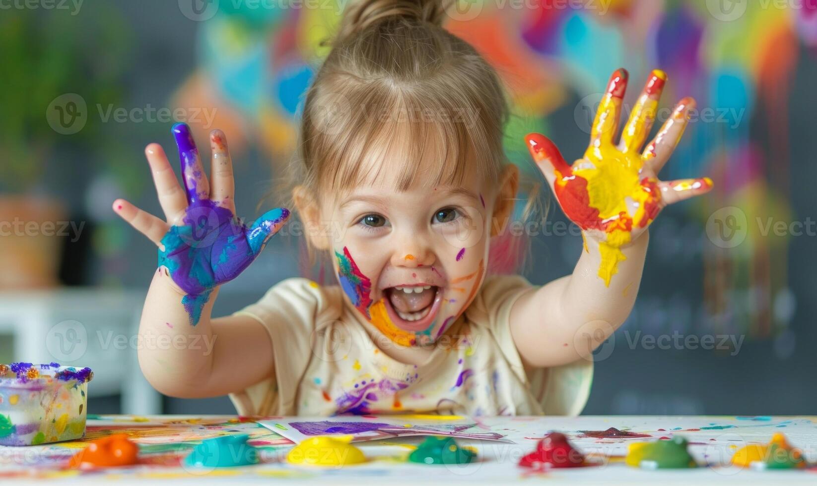 AI generated Little child making colorful hands while sitting at a table, world art day artwork photo