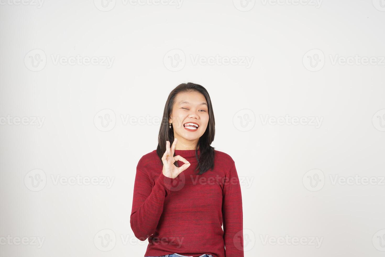 Young Asian woman in Red t-shirt smiling and showing okay sign isolated on white background photo